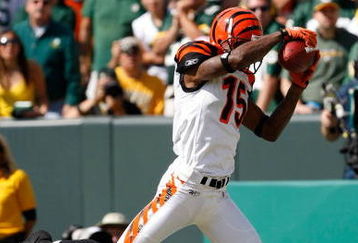 GREEN BAY, WI - SEPTEMBER 20: Wide receiver Chris Henry #15 of the Cincinnati Bengals catches the football for a touchdown in the 2nd quarter against the Green Bay Packers at Lambeau Field on September 20, 2009 in Green Bay, Wisconsin. (Photo by Scott Boehm/Getty Images)
