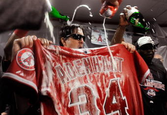 ANAHEIM, CA - SEPTEMBER 28:  Los Angeles Angels of Anaheim players douse the jersey of teammate pitcher Nick Adenhart #34 in beer and champagne as they celebrate after winning the American League West title in the baseball game against the Texas Rangers at Angel Stadium on September 28, 2009 in Anaheim, California. Adenhart was killed in a accident by an alleged drunk driver during the beginning of the season.  (Photo by Kevork Djansezian/Getty Images)