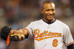 KANSAS CITY - MAY 14:  Melvin Mora #6 of the Baltimore Orioles walks off the field with Cesar Izturis #3 against the Kansas City Royals on May 14, 2009 at Kauffman Stadium in Kansas City, Missouri. (Photo by: Jamie Squire/Getty Images)