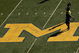ANN ARBOR, MI - SEPTEMBER 19:  Michigan Wolverines players warm up for their game with the Eastern Michigan Eagles at Michigan Stadium on September 19, 2009 in Ann Arbor, Michigan.  (Photo by Stephen Dunn/Getty Images)