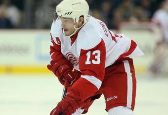 COLUMBUS, OHIO - APRIL 23:  Pavel Datsyuk #13 of the Detroit Red Wings skates with the puck against the Columbus Blue Jackets during Game Four of the Western Conference Quarterfinals of the 2009 Stanley Cup Playoffs on April 23, 2009 at the Nationwide Arena in Columbus, Ohio. The Red Wings defeated the Blue Jackets 6-5 on a late goal by Johan Franzen to eliminate the Blue Jackets 4 games to 0. (Photo by Claus Andersen/Getty Images
