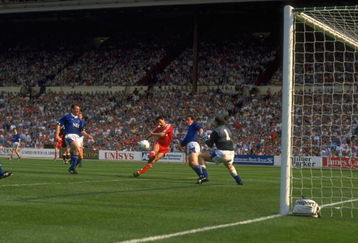 May 1989:  Ian Rush (centre) of Liverpool beats goalkeeper Neville Southall of Everton to score their second goal during the FA Cup final at Wembley Stadium in London. Liverpool won the match 3-2. \ Mandatory Credit: Simon  Bruty/Allsport