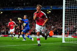LONDON, ENGLAND - SEPTEMBER 29:  Andrey Arshavin of Arsenal celebrates scoring the second goal during the UEFA Champions League Group H match between Arsenal and Olympiakos at the Emirates Stadium on September 29, 2009 in London, England.  (Photo by Mike Hewitt/Getty Images)