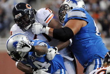 DETROIT - OCTOBER 05:  Nathan Vasher #71 of the Chicago Bears tackles Kevin Smith #34 of the Detroit Lions during the quarter at Ford Field on October 5, 2008 in Detroit, Michigan.  (Photo by Harry How/Getty Images)