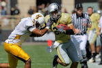 BOULDER, CO - SEPTEMBER 19:  Wide reciever Scotty McKnight #21 of the Colorado Buffaloes makes a reception for a first down before being forced out of bounds by Shamiel Gary #7 of the Wyoming Cowboys at Folsom Field on September 19, 2009 in Boulder, Colorado. The Buffaloes defeated the Cowboys 24-0.  (Photo by Doug Pensinger/Getty Images)