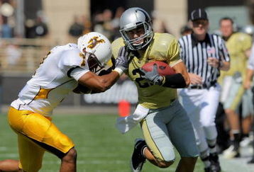 BOULDER, CO - SEPTEMBER 19:  Wide reciever Scotty McKnight #21 of the Colorado Buffaloes makes a reception for a first down before being forced out of bounds by Shamiel Gary #7 of the Wyoming Cowboys at Folsom Field on September 19, 2009 in Boulder, Colorado. The Buffaloes defeated the Cowboys 24-0.  (Photo by Doug Pensinger/Getty Images)