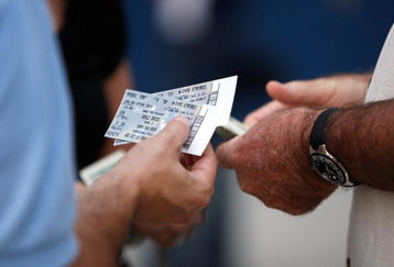 ST PETERSBURG, FL - OCTOBER 22:  A fan holds tickets before the Philadelphia Phillies take on the Tampa Bay Rays during game one of the 2008 MLB World Series on October 22, 2008 at Tropicana Field in St. Petersburg, Florida.  (Photo by Jamie Squire/Getty Images)
