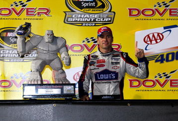 DOVER, DE - SEPTEMBER 27:  Jimmie Johnson, driver of the #48 Lowe's Chevrolet, celebrates with the trophy  in victory lane after winning the NASCAR Sprint Cup Series AAA 400 at Dover International Speedway on September 27, 2009 in Dover, Delaware.  (Photo by Geoff Burke/Getty Images for NASCAR)
