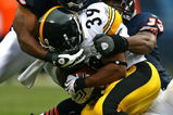 CHICAGO - SEPTEMBER 20: Danieal Manning #38 and Nick Roach #53 of the Chicago Bears bring down Willie Parker #39 of the Pittsburgh Steelers on September 20, 2009 at Soldier Field in Chicago, Illinois. The Bears defeated the Steelers 17-14. (Photo by Jonathan Daniel/Getty Images)