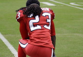 HOUSTON - SEPTEMBER 27:  Cornerback Dunta Robinson #23 of the Houston Texans watches from the sidelines during pre-game warmups before the game against the Jacksonville Jaguars at Reliant Stadium on September 27, 2009 in Houston, Texas.  (Photo by Bob Levey/Getty Images)