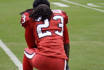HOUSTON - SEPTEMBER 27:  Cornerback Dunta Robinson #23 of the Houston Texans watches from the sidelines during pre-game warmups before the game against the Jacksonville Jaguars at Reliant Stadium on September 27, 2009 in Houston, Texas.  (Photo by Bob Levey/Getty Images)