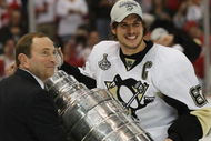DETROIT - JUNE 12: Sidney Crosby #87 of the Pittsburgh Penguins celebrates with the Stanley Cup following the Penguins victory over the Detroit Red Wings in Game Seven of the 2009 NHL Stanley Cup Finals at Joe Louis Arena on June 12, 2009 in Detroit, Michigan. (Photo by Bruce Bennett/Getty Images)