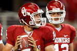ARLINGTON, TX - SEPTEMBER 05:  Quarterback Sam Bradford #14 of the Oklahoma Sooners warms up before a game against the Brigham Young Cougars at Cowboys Stadium on September 5, 2009 in Arlington, Texas.  (Photo by Ronald Martinez/Getty Images)
