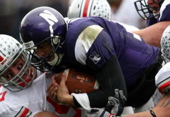 EVANSTON, IL - NOVEMBER 08:  Quarterback Mike Kafka #13 of the Northwestern Wildcats is tackled by Ross Homan #51 of the Ohio State Buckeyes at Ryan Stadium on November 8, 2008 in Evanston, Illinois  (Photo by Jonathan Ferrey/Getty Images)