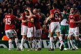 MANCHESTER, ENGLAND - SEPTEMBER 30:  Ryan Giggs of Manchester United is congratulated by his team mates after scoring his team's first goal during the UEFA Champions League Group B match between Manchester United and VfL Wolfsburg at Old Trafford on September 30, 2009 in Manchester, England.  (Photo by Michael Regan/Getty Images)
