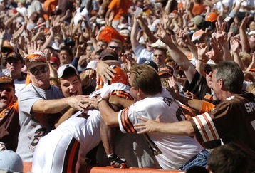 CLEVELAND - AUGUST 21:  Running back Lee Suggs #44 of the Cleveland Browns is welcomed into the Dawg Pound after scoring a touchdown during the second quarter of the pre-season game between the Cleveland Browns and the Detroit Lions on August 21, 2004 at Cleveland Browns Stadium in Cleveland, Ohio. Cleveland defeated Detroit 17-10.  (Photo by David Maxwell/Getty Images)