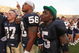 SOUTH BEND, IN - SETPEMBER 19: (L-R) Mike Anello #37, Brian Smith #58 and Armando Allen, Jr. #5, (wearing the hat of the leprechaun mascot) of the Notre Dame Fighting Irish sing with students after a win over the Michigan State Spartans on September 19, 2009 at Notre Dame Stadium in South Bend, Indiana. Notre Dame defeated Michigan State 33-30. (Photo by Jonathan Daniel/Getty Images)