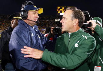 ANN ARBOR, MI - OCTOBER 25: Head coach Mark Dantonio of the Michigan State Spartans shakes hands with head coach Rich Rodriguez of the Michigan Wolverines after a Michigan State 35-21 victory on October 25, 2008 at Michigan Stadium in Ann Arbor, Michigan.  (Photo by Gregory Shamus/Getty Images)