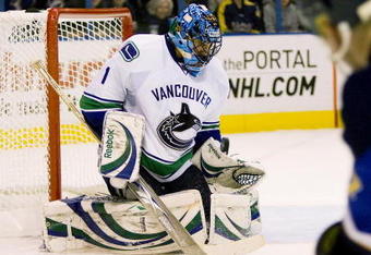 ST. LOUIS, MO. - APRIL 21: Roberto Luongo #1 of the Vancouver Canucks makes a save against the St. Louis Blues during Game Four of the Western Conference Quarterfinals of the 2009 NHL Stanley Cup Playoffs at the Scottrade Center on April 21, 2009 in St. Louis, Missouri.  (Photo by Dilip Vishwanat/Getty Images)