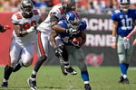 TAMPA, FL - SEPTEMBER 27:  Safety Will Allen #26 of the Tampa Bay Buccaneers attempts to bring down running back Ahmad Bradshaw #44 of the New York Giants during the game at Raymond James Stadium on September 27, 2009 in Tampa, Florida.  (Photo by J. Meric/Getty Images)