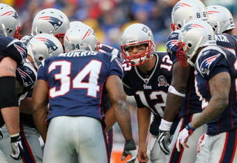 FOXBORO, MA - SEPTEMBER 27:  Quarterback Tom Brady #12 of the New England Patriots talks in a team huddle during the third quarter of the game against the Atlanta Falcons at Gillette Stadium on September 27, 2009 in Foxboro, Massachusetts.  (Photo by Jim Rogash/Getty Images)