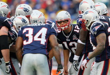 FOXBORO, MA - SEPTEMBER 27:  Quarterback Tom Brady #12 of the New England Patriots talks in a team huddle during the third quarter of the game against the Atlanta Falcons at Gillette Stadium on September 27, 2009 in Foxboro, Massachusetts.  (Photo by Jim Rogash/Getty Images)