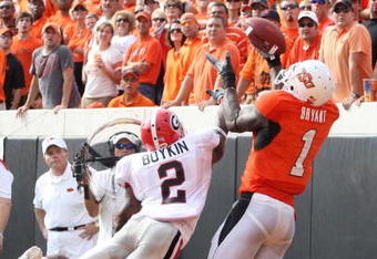 STILLWATER, OK - SEPTEMBER 5:  Runningback Brandon Boykin #2 of the Georgia Bulldogs dives for the ball for the ball as Dez Bryant #1 of the Oklahoma State Cowboys cannot make the pass during the third quarter of the game at Boone Pickens Stadium on September 5, 2009 in Stillwater, Oklahoma. (Photo by Christian Petersen/Getty Images)