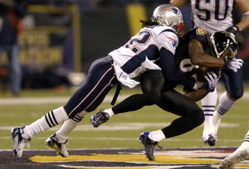 BALTIMORE - DECEMBER 3:  Derrick Mason #85 of the Baltimore Ravens is tackled by Asante Samuel #22 of the New England Patriots at M&T Bank Stadium December 3, 2007 in Baltimore, Maryland.  (Photo by Greg Fiume/Getty Images)