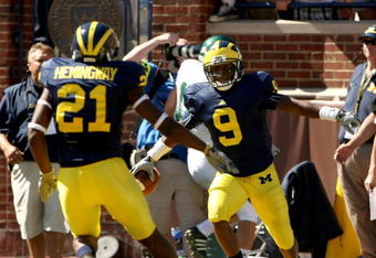 ANN ARBOR, MI - SEPTEMBER 19:  Receiver Martavious Odoms #9 of the Michigan Wolverines celebrates his touchdown with Junior Hemingway #21 in the game with the Eastern Michigan Eagles at Michigan Stadium on September 19, 2009 in Ann Arbor, Michigan. (Photo by Stephen Dunn/Getty Images)