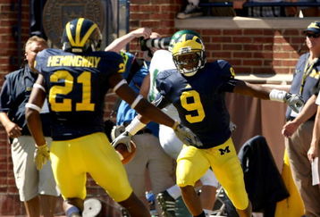 ANN ARBOR, MI - SEPTEMBER 19:  Receiver Martavious Odoms #9 of the Michigan Wolverines celebrates his touchdown with Junior Hemingway #21 in the game with the Eastern Michigan Eagles at Michigan Stadium on September 19, 2009 in Ann Arbor, Michigan. (Photo by Stephen Dunn/Getty Images)