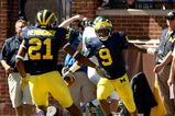 ANN ARBOR, MI - SEPTEMBER 19:  Receiver Martavious Odoms #9 of the Michigan Wolverines celebrates his touchdown with Junior Hemingway #21 in the game with the Eastern Michigan Eagles at Michigan Stadium on September 19, 2009 in Ann Arbor, Michigan. (Photo by Stephen Dunn/Getty Images)