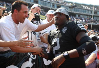 OAKLAND, CA - SEPTEMBER 27:  JaMarcus Russell #2 of the Oakland Raiders meets fans before his game against the Denver Broncos on September 27, 2009 during an NFL game at the Oakland-Alameda County Coliseum in Oakland, California.  (Photo by Jed Jacobsohn/Getty Images)