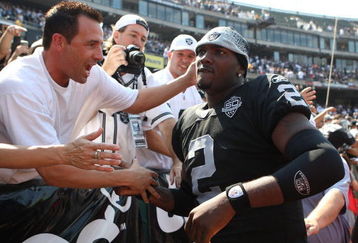 OAKLAND, CA - SEPTEMBER 27:  JaMarcus Russell #2 of the Oakland Raiders meets fans before his game against the Denver Broncos on September 27, 2009 during an NFL game at the Oakland-Alameda County Coliseum in Oakland, California.  (Photo by Jed Jacobsohn/Getty Images)