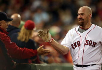 BOSTON - SEPTEMBER 28:  Kevin Youkilis #20 of the Boston Red Sox celebrates his solo home run in the third inning against the Toronto Blue Jays on September 28, 2009 at Fenway Park in Boston, Massachusetts.  (Photo by Elsa/Getty Images)