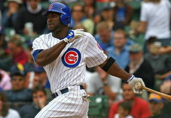 CHICAGO - AUGUST 28: Milton Bradley #21 of the Chicago Cubs hits the ball against the New York Mets on August 28, 2009 at Wrigley Field in Chicago, Illinois. The Cubs defeated the Mets 5-2. (Photo by Jonathan Daniel/Getty Images)