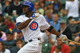 CHICAGO - AUGUST 28: Milton Bradley #21 of the Chicago Cubs hits the ball against the New York Mets on August 28, 2009 at Wrigley Field in Chicago, Illinois. The Cubs defeated the Mets 5-2. (Photo by Jonathan Daniel/Getty Images)