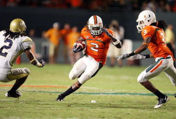 FORT LAUDERDALE, FL - SEPTEMBER 17:  Running back Graig Cooper #2 of the Miami Hurricanes looks to avoid being brought down by cornerback Mario Butler #2 of the Georgia Tech Yellow Jackets at Land Shark Stadium on September 17, 2009 in Fort Lauderdale, Florida. Miami defeated Georgia Tech 33-17.  (Photo by Doug Benc/Getty Images)