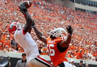 STILLWATER, OK - SEPTEMBER 5:  Wide receiver A.J. Green #8 of the Georgia Bulldogs is unable to hold onto the ball for an incomplete pass in front of Perrish Cox #16 of the Oklahoma State Cowboys during the first quarter of the game at Boone Pickens Stadium on September 5, 2009 in Stillwater, Oklahoma. (Photo by Christian Petersen/Getty Images)