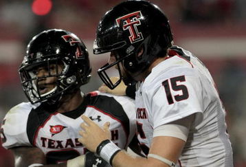 HOUSTON - SEPTEMBER 26: Quarterback Taylor Potts #15 congratulates running back Baron Batch #25 of the Texas Tech Red Raiders for scoring a touchdown against the Houston Cougars at Robertson Stadium on September 26, 2009 in Houston, Texas.  (Photo by Thomas B. Shea/Getty Images)