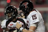 HOUSTON - SEPTEMBER 26: Quarterback Taylor Potts #15 congratulates running back Baron Batch #25 of the Texas Tech Red Raiders for scoring a touchdown against the Houston Cougars at Robertson Stadium on September 26, 2009 in Houston, Texas.  (Photo by Thomas B. Shea/Getty Images)
