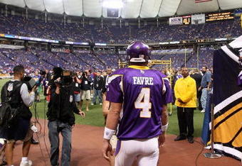 MINNEAPOLIS - SEPTEMBER 27: Brett Favre #4 of the Minnesota Vikings walks on to the field for warm-ups before his first regular season home game against the San Francisco 49ers at the Hubert H. Humphrey Metrodome on September 27, 2009 in Minneapolis, Minnesota. The Vikings defeatd the 49ers 27-24. (Photo by Jonathan Daniel/Getty Images)