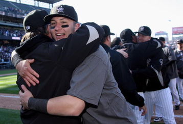 DENVER - OCTOBER 01:  Troy Tulowitzki of the Colorado Rockies celebrates with his teammates after they defeated the Milwaukee Brewers at Coors Field on October 1, 2009 in Denver, Colorado. The Rockies defeated the Brewers 9-2 and clinched a National League playoff berth.  (Photo by Doug Pensinger/Getty Images)