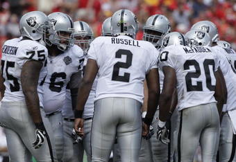 KANSAS CITY, MO - SEPTEMBER 20:  JaMarcus Russell #2 of the Oakland Raiders huddles with the offense during the game against the Kansas City Chiefs at Arrowhead Stadium on September 20, 2009 in Kansas City, Missouri. (Photo by Jamie Squire/Getty Images)
