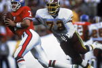 SAN DIEGO - JANUARY 31:  Quarterback John Elway #7 of the Denver Broncos tries to avoid an onrushing Dexter Manley #72 of the Washington Redskins during Superbowl XXII on January 31, 1988 at San Diego Jack Murphy Stadium in San Diego, California.  The Redskins defeated the Broncos 42-10. (Photo by Mike Powell/Getty Images)