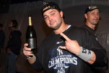 NEW YORK - SEPTEMBER 27:  Nick Swisher #33 of the New York Yankees celebrates in the clubhouse after his team defeated the Boston Red Sox on September 27, 2009 at Yankee Stadium in the Bronx borough of New York City. The Yankees won the game 4-2 to earn their 100th win of the season as well as clinching the American League Eastern Division.  (Photo by Jim McIsaac/Getty Images)