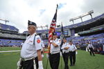 BALTIMORE - SEPTEMBER 27:  The color guard brings the American flag onto the field before the game between the Baltimore Ravens and the Cleveland Browns at M&T Bank Stadium on September 27, 2009 in Baltimore, Maryland. The Ravens defeated the Browns 34-3. (Photo by Larry French/Getty Images)
