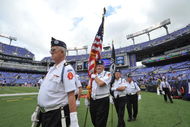 BALTIMORE - SEPTEMBER 27:  The color guard brings the American flag onto the field before the game between the Baltimore Ravens and the Cleveland Browns at M&T Bank Stadium on September 27, 2009 in Baltimore, Maryland. The Ravens defeated the Browns 34-3. (Photo by Larry French/Getty Images)