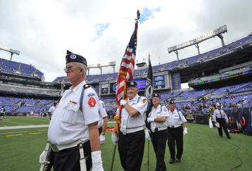BALTIMORE - SEPTEMBER 27:  The color guard brings the American flag onto the field before the game between the Baltimore Ravens and the Cleveland Browns at M&T Bank Stadium on September 27, 2009 in Baltimore, Maryland. The Ravens defeated the Browns 34-3. (Photo by Larry French/Getty Images)