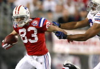 FOXBORO, MA - SEPTEMBER 14:  Wes Welker #83 of the New England Patriots runs away from George Wilson #37 of the Buffalo Bills on September 14, 2009 at Gillette Stadium in Foxboro, Massachusetts. (Photo by Elsa/Getty Images)