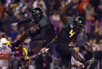 SAN DIEGO, CA - DECEMBER 30:   Runningback LeGarrette Blount #9 of the University of Oregon Ducks celebrates his touchdown with teammate Jaison Williams #4 during his team's 42-31 win over the Oklahoma State University Cowboys in the Pacific Life Holiday Bowl at Qualcomm Stadium on December 30, 2008 in San Diego, California. (Photo by Donald Miralle/Getty Images)